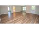Spacious living room featuring flooring, natural light, and neutral walls at 10074 Tara Glynn Dr, Hampton, GA 30228