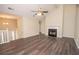 Bright living room with a vaulted ceiling, a fireplace, and new flooring at 10074 Tara Glynn Dr, Hampton, GA 30228