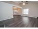 Open concept living area with elegant flooring, modern lighting, and access to the dining room at 10074 Tara Glynn Dr, Hampton, GA 30228