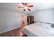 Bedroom featuring hardwood floors, neutral walls, and closet space, creating a comfortable retreat at 10900 Wittenridge Dr # C7, Alpharetta, GA 30022