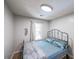 Bedroom features a metal bed frame, wood floors, and natural light from the window at 10900 Wittenridge Dr # C7, Alpharetta, GA 30022