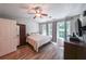 Bright bedroom with hardwood floors, ample closet space, and large windows for natural light at 10900 Wittenridge Dr # C7, Alpharetta, GA 30022