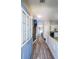 Inviting entryway with hardwood floors leading to the living area and staircase at 10900 Wittenridge Dr # C7, Alpharetta, GA 30022