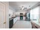 Well-lit kitchen with white cabinets, stainless steel appliances, and tile floors at 10900 Wittenridge Dr # C7, Alpharetta, GA 30022