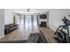 Cozy living room with a fireplace, hardwood floors, and sliding glass doors at 10900 Wittenridge Dr # C7, Alpharetta, GA 30022