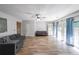Spacious living room with hardwood floors, modern furniture, and bright natural light at 10900 Wittenridge Dr # C7, Alpharetta, GA 30022
