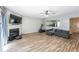 Inviting living room featuring a fireplace, hardwood floors, and an open layout for seamless entertaining at 10900 Wittenridge Dr # C7, Alpharetta, GA 30022