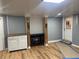 Basement featuring new light fixture and wood-look flooring, showcasing storage options at 1321 Earle Se Ct, Conyers, GA 30013