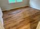 Bright, well-lit bedroom featuring laminate flooring and large window offering lots of natural light at 1321 Earle Se Ct, Conyers, GA 30013