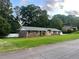 Beautiful brick home with well-maintained lawn and lush greenery surrounding the property at 1321 Earle Se Ct, Conyers, GA 30013