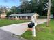 Charming brick home featuring a well-maintained lawn and an extended driveway at 1321 Earle Se Ct, Conyers, GA 30013