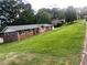 Charming brick home with manicured lawn, mature trees, and inviting curb appeal at 1321 Earle Se Ct, Conyers, GA 30013