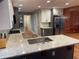 Updated kitchen featuring granite counters, stainless appliances, and views to the bathroom at 1321 Earle Se Ct, Conyers, GA 30013