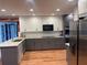 Updated kitchen featuring stainless steel appliances, granite countertops, and two-tone cabinets at 1321 Earle Se Ct, Conyers, GA 30013