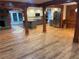 Open floor plan with hardwood floors, wooden beams, stainless steel appliances, and dining area at 1321 Earle Se Ct, Conyers, GA 30013