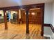 Spacious open-concept living room area with wood columns, dining and kitchen area at 1321 Earle Se Ct, Conyers, GA 30013