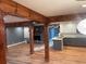 Living room featuring exposed beams, a fireplace, and an open layout to the kitchen at 1321 Earle Se Ct, Conyers, GA 30013