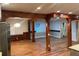 Spacious living room with hardwood floors, timber frame, and large windows for plenty of natural light at 1321 Earle Se Ct, Conyers, GA 30013