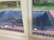 View from a window looking at the covered outdoor pool at 1321 Earle Se Ct, Conyers, GA 30013
