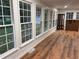 This sunroom is bright with lots of windows, showcasing hardwood floors at 1321 Earle Se Ct, Conyers, GA 30013