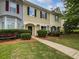 Charming townhome with a landscaped front yard, inviting walkway, and classic architectural details at 25 Timber Ridge Dr, Cartersville, GA 30121