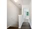 Bright hallway with hardwood floors and a view to a bedroom with a large window at 25 Timber Ridge Dr, Cartersville, GA 30121