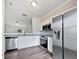 Modern kitchen featuring stainless steel appliances, sleek countertops, and white cabinetry at 25 Timber Ridge Dr, Cartersville, GA 30121