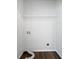 The laundry room has dark wood-look floors and white walls with a shelf at 25 Timber Ridge Dr, Cartersville, GA 30121