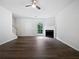 Spacious living room featuring a fireplace, updated flooring, and a bright window at 25 Timber Ridge Dr, Cartersville, GA 30121
