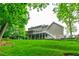 Backyard with a large deck and covered patio offering a serene outdoor living space at 3394 Floral Ct, Suwanee, GA 30024