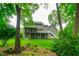 Backyard featuring a spacious deck and patio with lush green lawn, perfect for outdoor activities at 3394 Floral Ct, Suwanee, GA 30024