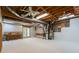Basement featuring concrete floors, exposed ceiling, utility components, and walkout access at 3394 Floral Ct, Suwanee, GA 30024