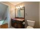Bathroom featuring a granite countertop vanity at 3394 Floral Ct, Suwanee, GA 30024