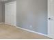 Bedroom showcasing neutral walls, plush carpeting, and closet at 3394 Floral Ct, Suwanee, GA 30024
