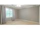 Bright bedroom with natural light, complemented by neutral tones and window coverings at 3394 Floral Ct, Suwanee, GA 30024