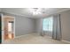Bright bedroom with natural light, complemented by neutral tones and window coverings at 3394 Floral Ct, Suwanee, GA 30024