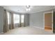 Spacious bedroom with bay window and plush carpeting for a comfortable retreat at 3394 Floral Ct, Suwanee, GA 30024