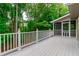Spacious deck with white railings, perfect for enjoying the surrounding greenery and outdoor relaxation at 3394 Floral Ct, Suwanee, GA 30024