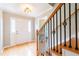 Inviting foyer with hardwood floors, elegant staircase with iron railing, and bright front door at 3394 Floral Ct, Suwanee, GA 30024