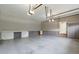 Attached garage featuring overhead lighting and built-in storage, providing functional space at 3394 Floral Ct, Suwanee, GA 30024
