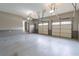 Attached two-car garage with paneled doors and closet, offering convenience and storage space at 3394 Floral Ct, Suwanee, GA 30024