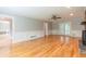 Open living space with fireplace, hardwood floors, and easy access to the backyard at 3394 Floral Ct, Suwanee, GA 30024
