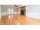 Spacious living room features a stone fireplace and access to the exterior patio at 3394 Floral Ct, Suwanee, GA 30024