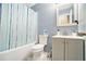 Updated bathroom with a shower-tub combo and patterned tile floors at 4211 Wingfoot Ct, Decatur, GA 30035