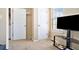 Carpeted bedroom featuring closet space and neutral walls at 4211 Wingfoot Ct, Decatur, GA 30035