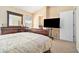 Comfortable bedroom with a king-sized bed, dresser, and a wall-mounted television at 4211 Wingfoot Ct, Decatur, GA 30035
