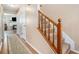 Inviting foyer with wood floors, carpeted stairs, and view into the cozy living area at 4211 Wingfoot Ct, Decatur, GA 30035