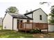 Exterior view showcasing backyard deck with outdoor access to home at 5072 Plantation View Trl, Stone Mountain, GA 30088