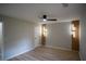 Updated bedroom with hardwood floors, ceiling fan, and paneled accent wall at 5072 Plantation View Trl, Stone Mountain, GA 30088