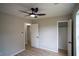 Bedroom featuring neutral paint, ceiling fan, and wood-look floors at 5072 Plantation View Trl, Stone Mountain, GA 30088